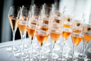 A refined arrangement of champagne flutes filled with sparkling wine, perfect for celebrations and events.
